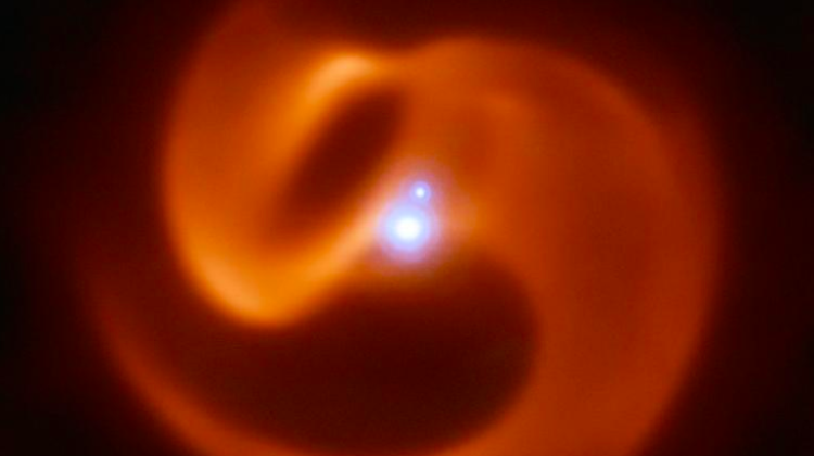 Dust cloud surrounding the triple star system 2XMM J160050.7-514245 (informally called Apep). The pinwheel structure is generated by the collision of stellar winds from two Wolf-Rayet stars. Credit: ESO/Callingham et al.