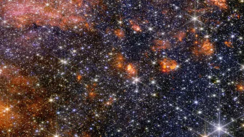 Obłok molekularny Sagittarius B2 sfotografowany w bliskiej podczerwieni przez Kosmiczny Teleskop Jamesa Webba. Źródło: NASA, ESA, CSA, STScI, A. Ginsburg (University of Florida), N. Budaiev (University of Florida), T. Yoo (University of Florida). Przetwarzanie obrazu: A. Pagan (STScI).